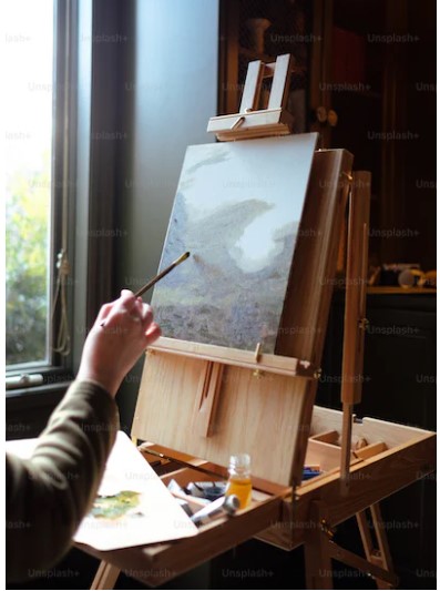 An image showing an artist painting